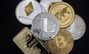 metallic representations of various cryptocurrencies, including Bitcoin, Ethereum, Litecoin, and Ripple