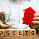 Man holding red house and roll of dollars over word "assets"